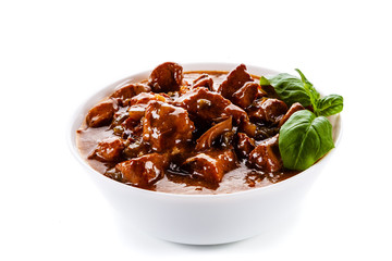 Goulash - roast meat in sauce on white background
