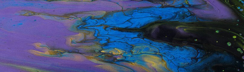 art photography of abstract marbleized effect background. Black, blue, gold, yellow and purple creative colors. Beautiful paint