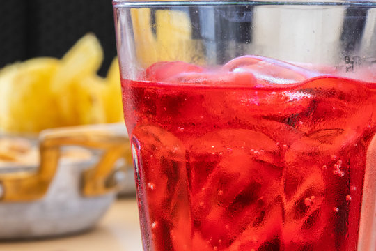 Morning aperitif at the bar. A red campari with ice to quench your thirst on a hot June day..