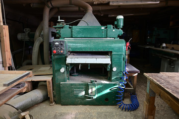 A photo of a woodworking machine in a workshop. Universal industrial concept.
