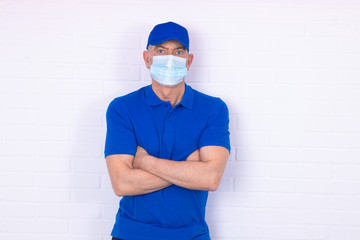 Fototapeta na wymiar worker with face mask isolated on background