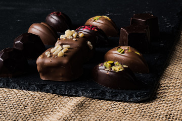 Homemade belgian chocolate. Close-up chocolate.  Religious Holiday, The Sugar Feast After Ramadan. Blurred background. Copy space for text message.