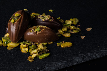 Homemade belgian chocolate. Close-up chocolate.  Religious Holiday, The Sugar Feast After Ramadan. Blurred background. Copy space for text message.