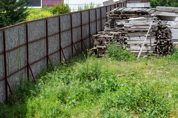 old wooden fence with grass