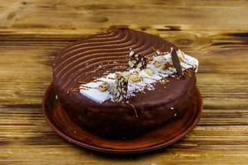 Tasty chocolate cake on a wooden table
