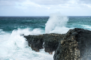 sea rock is breaking powerful wave in Mauritius