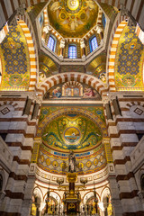 Altar and beautiful mosaics inside the Notre Dame de la Garde basilica, the most famous landmark of Marseille, France