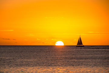 Obraz na płótnie Canvas A beautiful yacht sails in the open ocean
