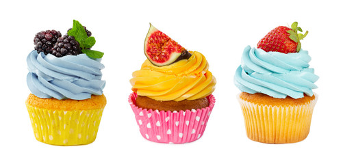 Set of cupcakes with fresh berries isolated on white