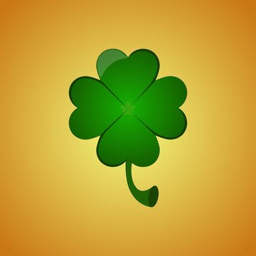 Four leaf clover on orange background. Greeting card for St. Patrick's Day.