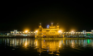 Fototapeta na wymiar Night View The Harmindar Sahib, also known as Golden Temple Amritsar 