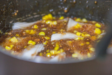 A blurry abstract background of a healthy dessert menu (sago from natural trees), bring to heat and add coconut milk, corn together, moderately sweet taste