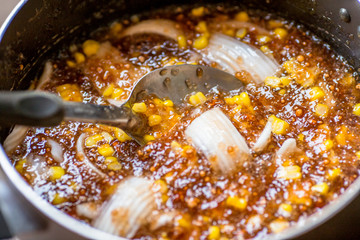 A blurry abstract background of a healthy dessert menu (sago from natural trees), bring to heat and add coconut milk, corn together, moderately sweet taste