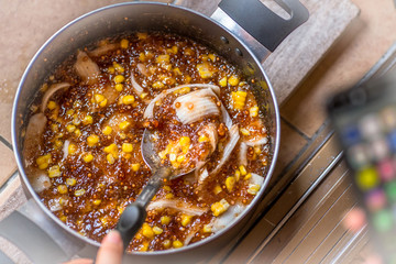 A blurry abstract background of a healthy dessert menu (sago from natural trees), bring to heat and add coconut milk, corn together, moderately sweet taste