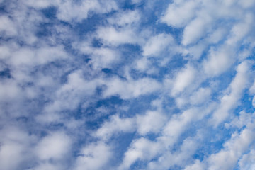 Bright blue sky with white clouds