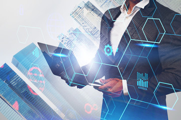 Man with laptop in city, business interface