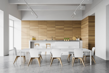 White and wooden kitchen interior with table