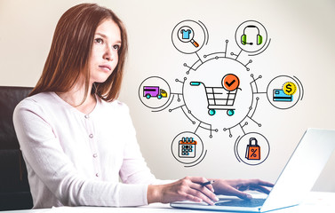 Woman using laptop, online shopping cart icons