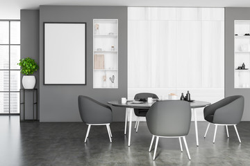 Gray and wooden dining room with poster