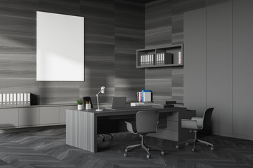 Gray and wood CEO office corner with poster