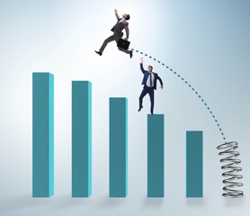 Businessman outperforming his competition jumping over