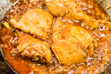 Frying chicken  with chili paste in pan, outdoor Chiangmai Thailand