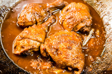 Frying chicken  with chili paste in pan, outdoor Chiangmai Thailand