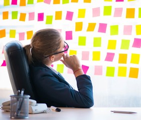 Beautiful female employee with many conflicting priorities