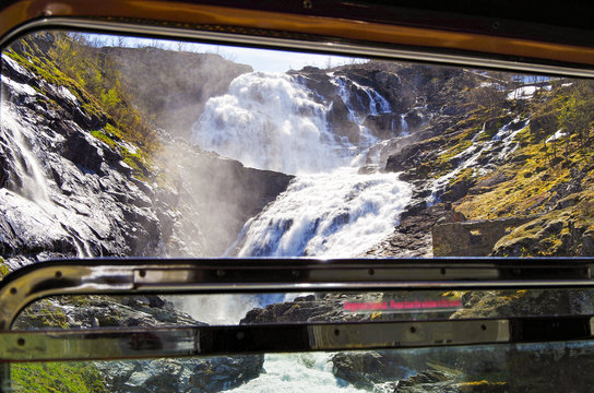Kjosfossen waterfall along the most beautiful train journey Flamsbana between Flam and Myrdal in Aurland in Western Norway