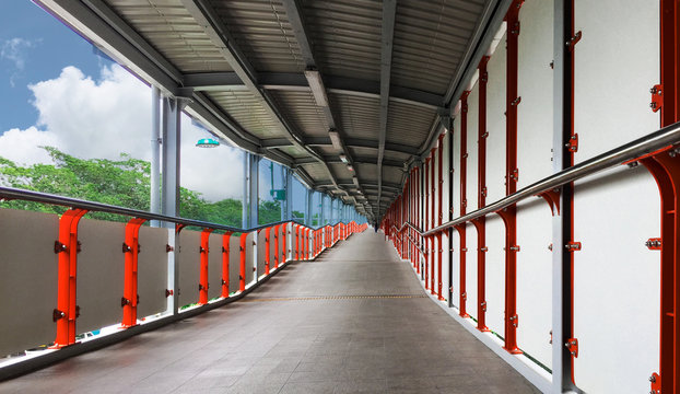  Sky walk bridge links to the bts sky train as modern transportation networks in Bangkok, Thailand.