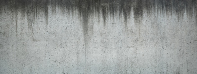 Horizontal picture of old and stained concrete wall with dripped water signs, suitable for backgrounds - Powered by Adobe