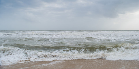 Sunshine pouring over the sea  through the clouds view from beach of somnath temple Gujarat India
