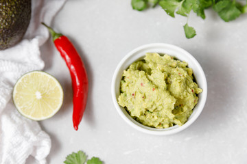 Mexican sauce guacamole with ingredients