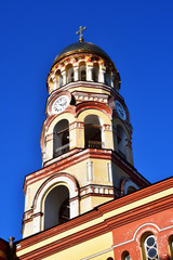 Fototapeta na wymiar Bell tower of New Athos monastery in August. Abkhazia