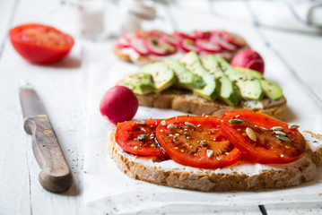 Vegetable sandwiches with radish, avocado and tomato, healthy vegan snack