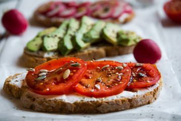 Vegetable sandwiches with radish, avocado and tomato, healthy vegan snack