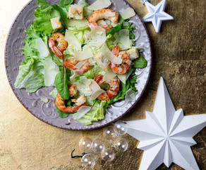 shrimp salad on a gold background with stars
