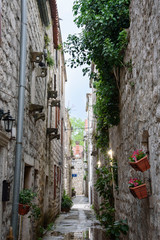 Fototapeta na wymiar Narrow street with stone facades, in Ston, Dubrovnik Neretva county, located on the Peljesac peninsula, Croatia, Europe.