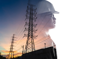 the double exposure image of the engineer thinking overlay with the high voltage pole image. The...