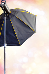 Photography set up with umbrella reflecting modeling lamp