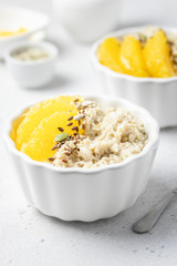 Healthy breakfast, citrus almond milk oats. Selective focus, copy space.