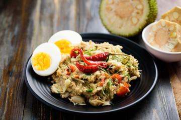 Northern Thai food (Tam Khanun), spicy pounded young jackfruit salad with boiled egg	