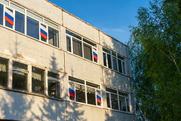 09.05.2020 Russia, Republic Of Bashkortostan. Russian flag on the Windows of apartment buildings.