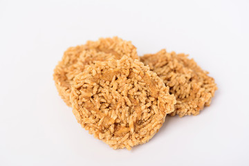 Deep fried sweet crispy rice with cane sugar drizzle isolated on white background, Local Thai snack (Khao Tan)	