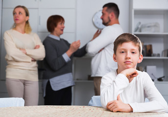 Upset son suffering from parental arguing