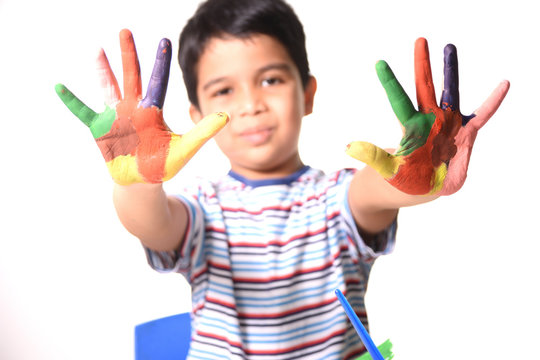 Young Indian Boy showing his painted hands
