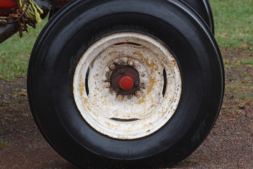 Front tractor tire on a wet day