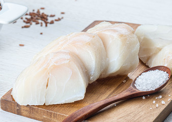 chopped cod on a wooden board