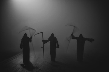 Death grim Reaper skeleton wearing a black robe and wielding a scythe, Memento Mori, Coronavirus,...
