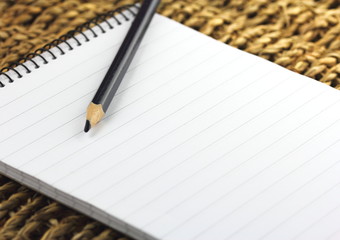 Empty note book wroting pad and pencil